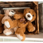 Plush teddy bears in a wooden crate
