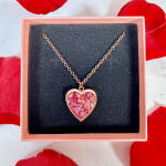 Heart-shaped pendant necklace in a pink gift box