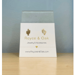 Jewelry display card with cactus-shaped earrings in a clear sleeve