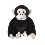 Black and white plush monkey toy sitting on a white background