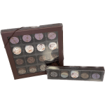 Two boxes of assorted decorated chocolates in brown packaging