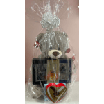 Gift basket with a teddy bear, cologne set, and heart-shaped chocolate box