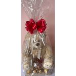 Teddy bear gift basket wrapped in clear plastic with a red bow