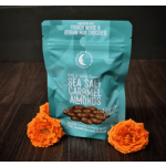 Bag of sea salt caramel almonds with two orange flowers
