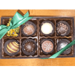 Box of assorted chocolates tied with green ribbon