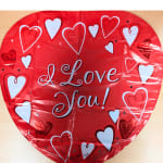 Red heart-shaped balloon with "I Love You!" text and white heart patterns