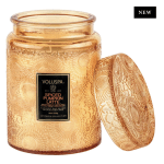 Amber glass candle jar with a matching lid