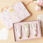 Gift set with three floral hand cream tubes in a pink box