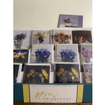 Display of floral art cards and prints in a shop rack