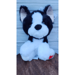 Black-and-white plush dog toy sitting upright