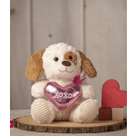 Plush dog holding a pink heart with "xoxo" and a small heart decoration