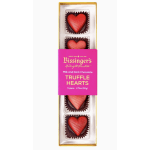 Box of heart-shaped chocolate truffles in red and pink
