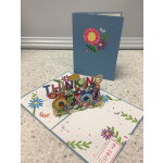 Pop-up thank-you card with colorful flowers and butterflies