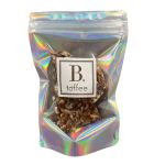 Bag of toffee candy with nuts in holographic packaging