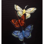Decorative butterfly picks in yellow, orange, and blue on thin stems
