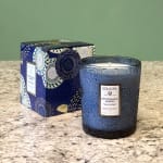 Blue patterned candle in a glass jar with matching box