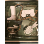 Ceramic baby-themed ornaments in a clear tray with rope ties