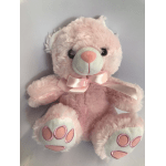 Pink teddy bear with a satin bow on a plain background
