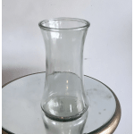 Clear glass vase on a mirrored surface