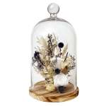 Dried floral arrangement under a glass cloche on a wooden base