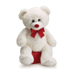 White teddy bear with a red bow sitting on a red box