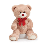 Plush teddy bear with a red bow sitting on a white base