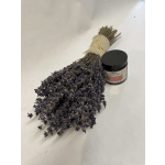 Bundle of dried purple lavender beside a small candle jar