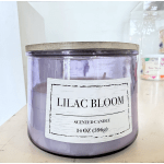 Lavender scented candle in a glass jar with a wooden lid