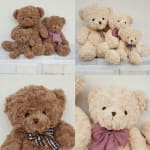 Four plush teddy bears with plaid bows arranged on a white shelf