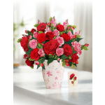 Floral-themed gift with red and pink rose arrangement in a patterned vase and a small matching rose card