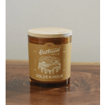 Amber candle in a glass jar with a wooden lid