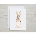 Watercolor rabbit holding a purple flower on a greeting card