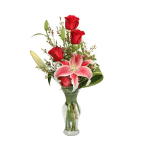 Red roses and pink lilies in a clear glass vase