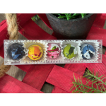 Box of five colorful painted chocolates in paper cups