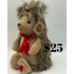 Plush hedgehog toy with a red ribbon and price tag