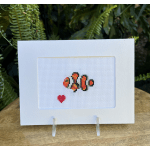Cross-stitch card with a clownfish and small red heart