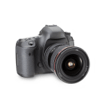 Black DSLR camera with attached lens on a white background
