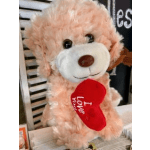 Plush teddy bear holding a red heart
