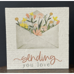 Decorative card with an envelope of flowers and the words "sending you love"