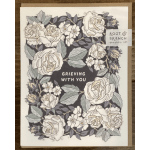 Floral sympathy card with white roses and the words "Grieving With You"