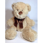 Beige teddy bear with a brown ribbon bow