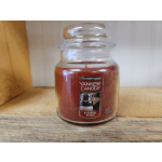 Jar candle labeled Yankee Candle Kitchen Spice