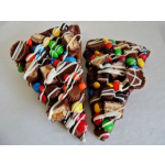 Two chocolate-covered treat cones topped with colorful candies