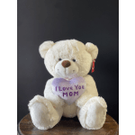 White teddy bear holding a heart that says I Love You Mom