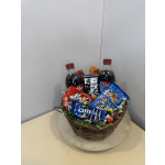 Basket of soda bottles and assorted candy and cookies