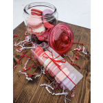 Jar and box of pastel macarons with a pink lid and ribbon