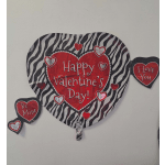 Heart-shaped Valentine’s Day balloon with zebra stripes and red hearts