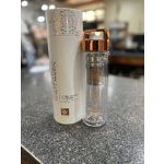 Two packaged travel tumblers with copper lids on a countertop