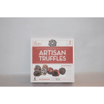 Box of artisan chocolate truffles on a plain surface