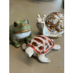 Three ceramic animal figurines shaped like a frog, snail, and turtle